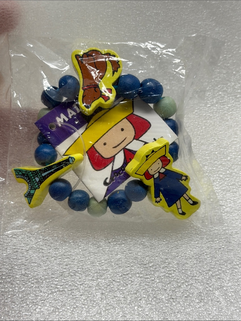 Madeline Blue and Light Green Beaded Kids Bracelet with Yellow Character Charms.